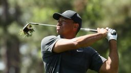 Tiger Woods plays an approach shot to the ninth during his battling first round at the Masters.