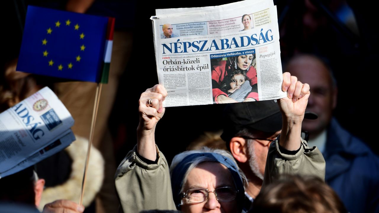 Journalists and supporters of newspaper Nepszabadsag protest in Budapest on October 16, 2016.