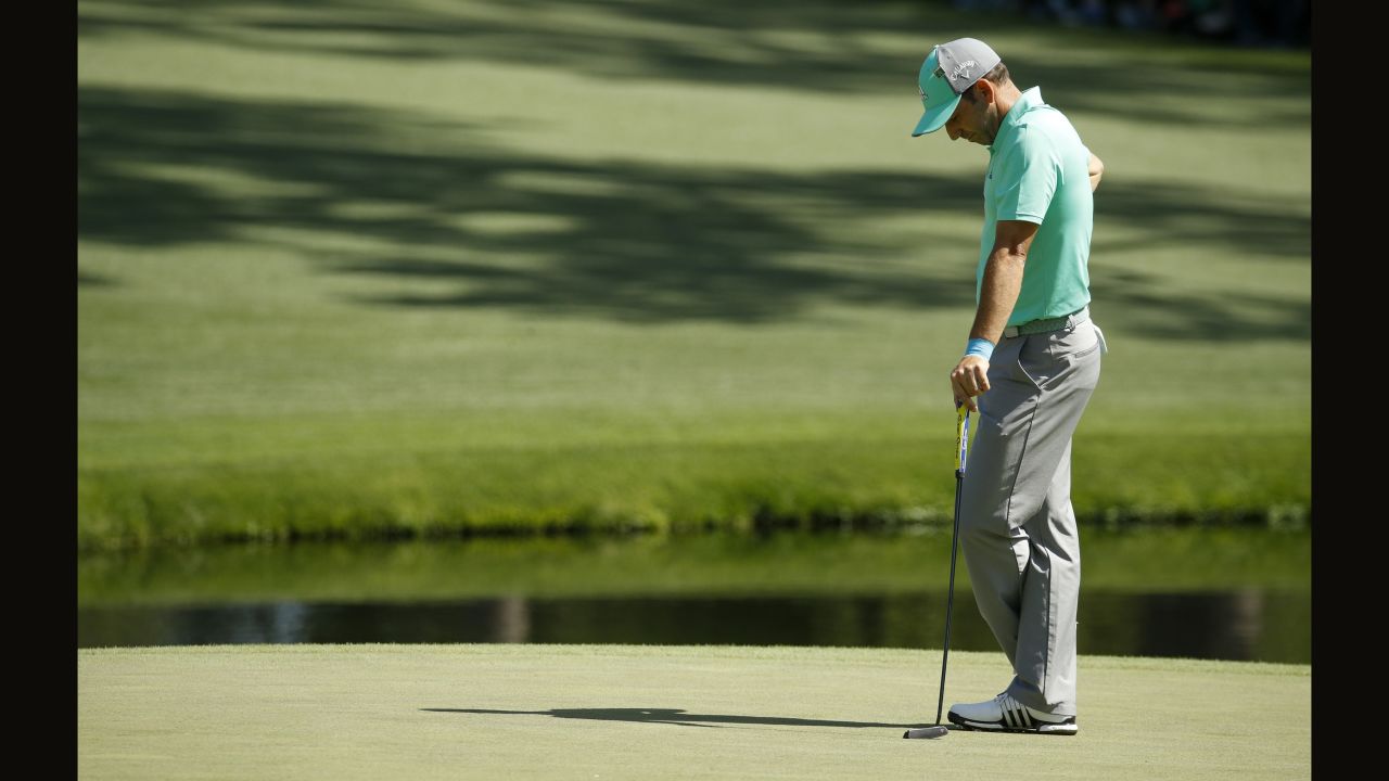 Defending champion Sergio Garcia pauses on the 15th hole, where he hit five shots in the water and made a 13 on Thursday. Its tied for the highest score ever made on one hole of the Masters.