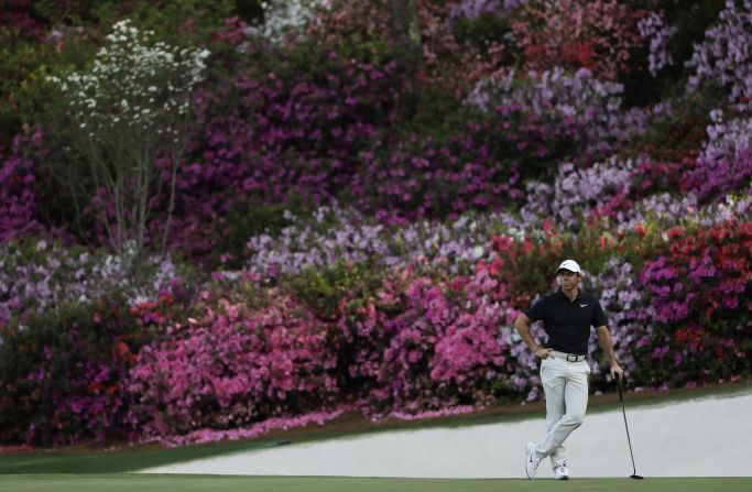 Rory McIlroy waits to putt on the 13th hole Thursday.