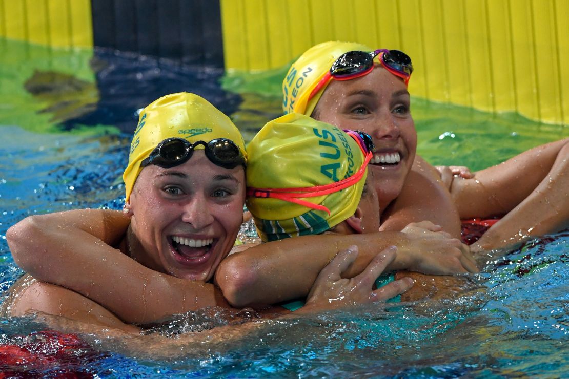 Emma McKeon (right, gold), Australia's Madeline Groves (silver) and Australia 's Brianna Throssell (bronze) celebrate after swimming the women's 100m butterfly final.