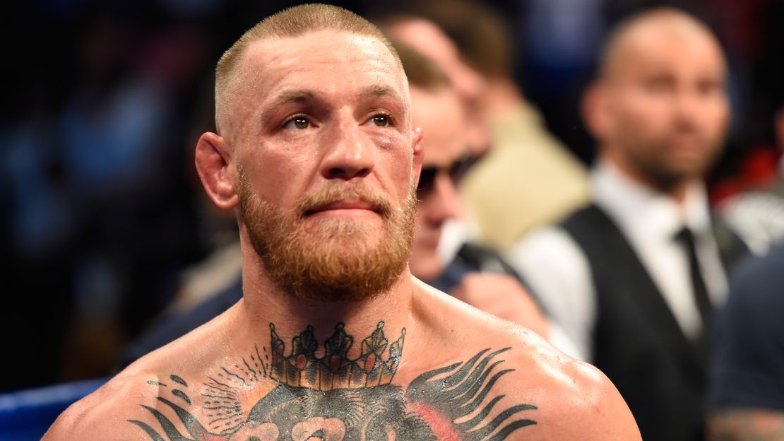 Conor McGregor stands in the ring after being defeated by Floyd Mayweather Jr. by TKO.