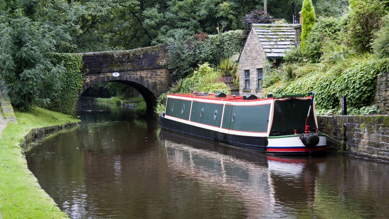 Narrowboats ply the canal waters of the Standedge Tunnel.