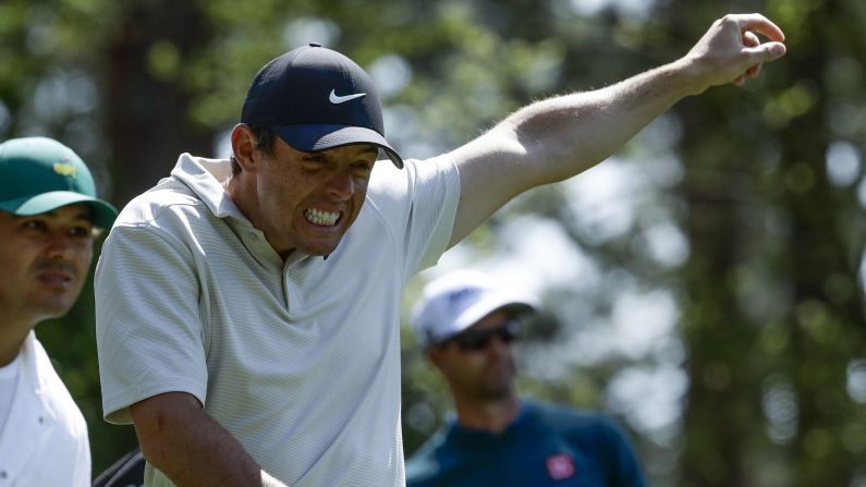 Rory McIlroy reacts to an Adam Scott shot on the fourth hole Friday.