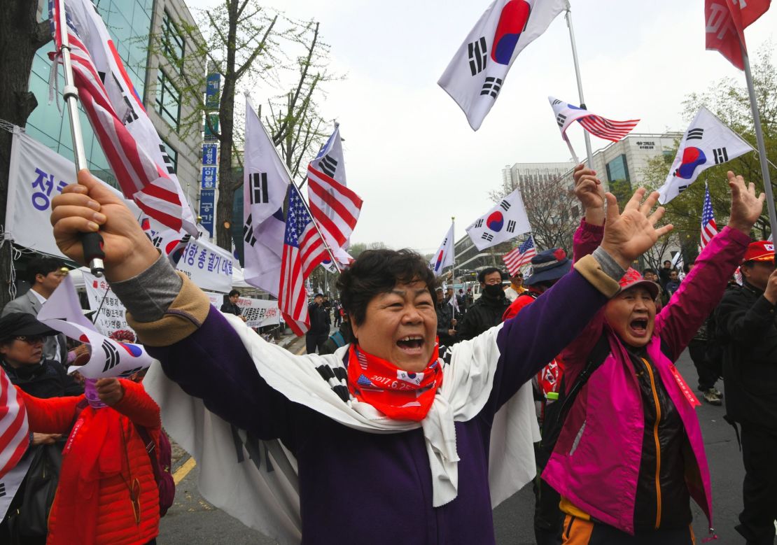Supporters of South Korea's former president Park Geun-hye gather during a rally demanding her release outside the Seoul Central District Court in Seoul on April 6, 2018.