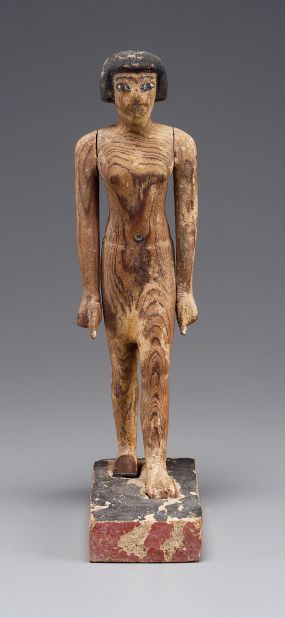 Statuettes were found within the tomb. This wooden figure of a striding man is thought to be Governor Djehutynakht. 