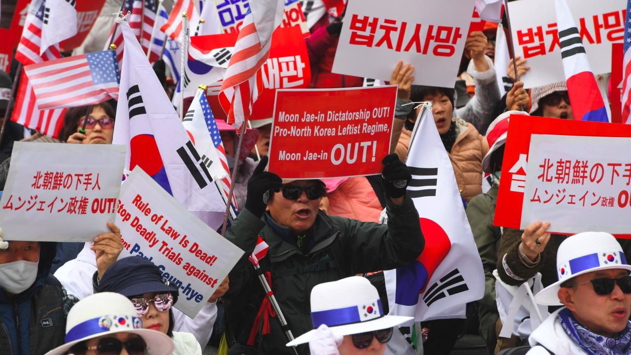 Supporters of South Korea's former president Park Geun-hye hold a rally demanding her release outside the Seoul Central District Court in Seoul on April 6, 2018.
