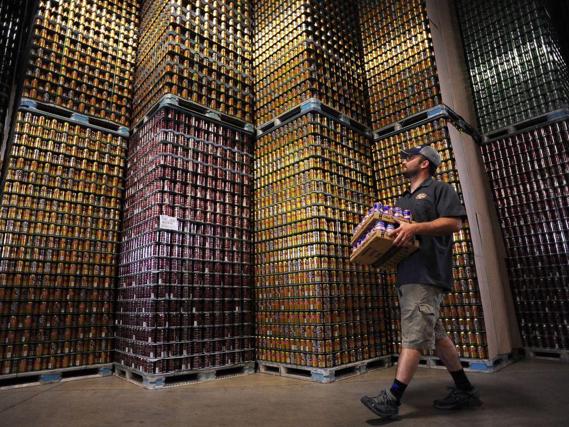 An employee carries beer at the Oskar Blues brewery and brew pub in Colorado. 