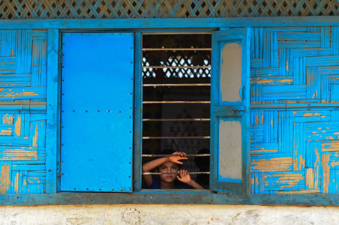 A Rohingya refugee looks out from a school window at Kutupalong refugee camp in Bangladesh's Ukhia district.
