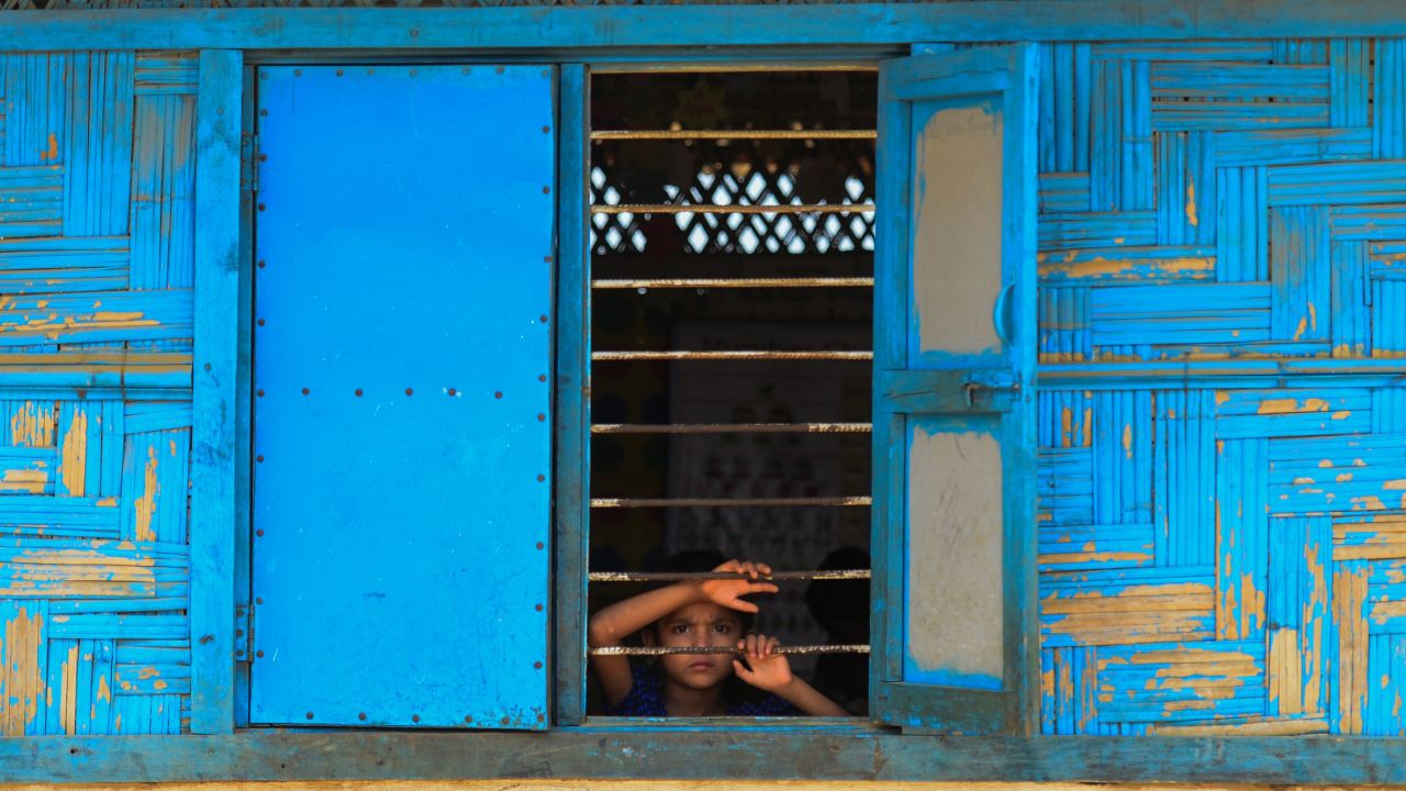 A Rohingya refugee looks out from a school window at Kutupalong refugee camp in Bangladesh's Ukhia district.