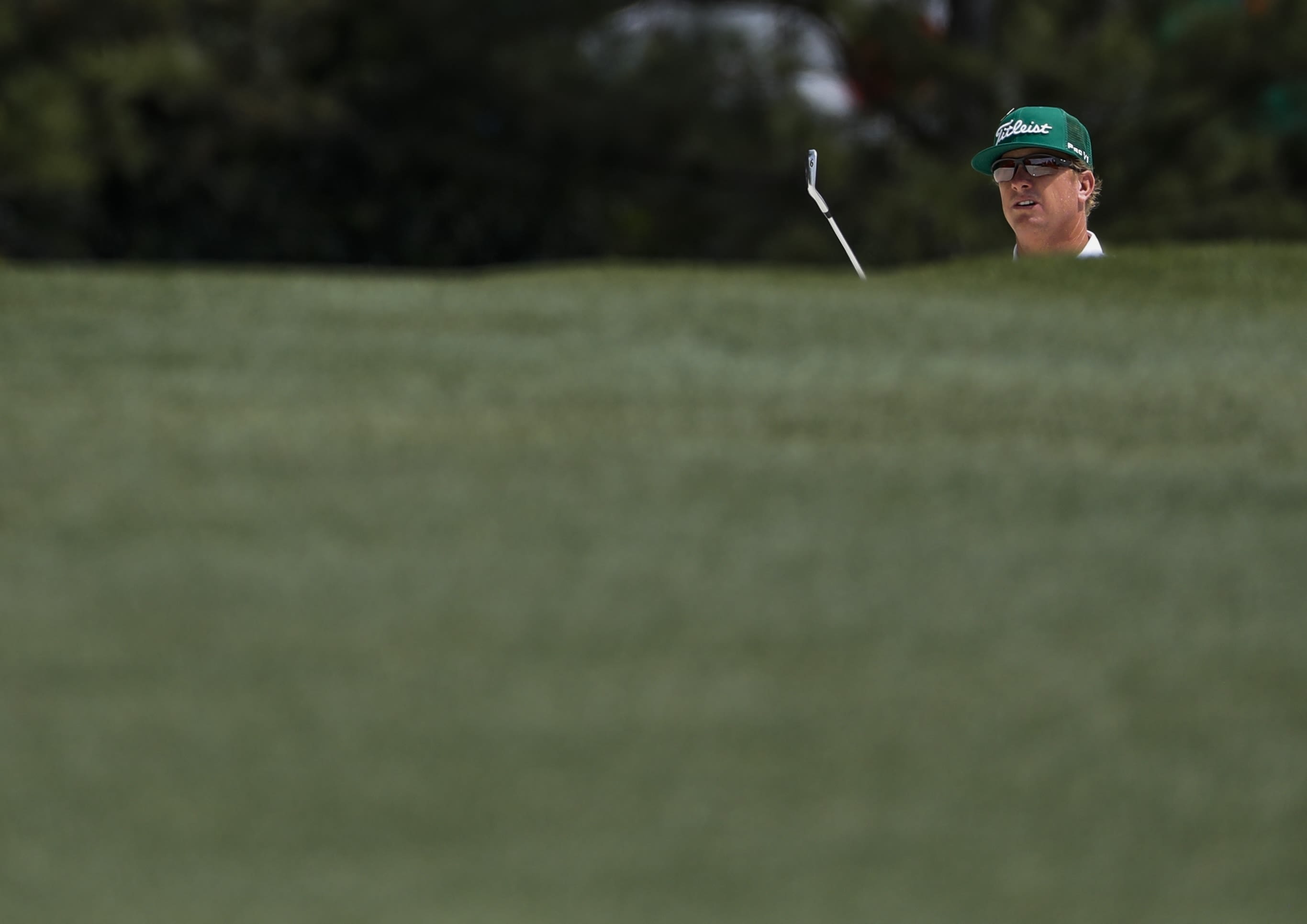 Charley Hoffman looks at a bunker shot on the first hole Friday.