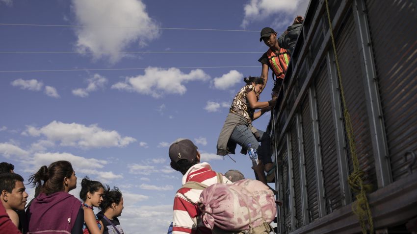 A group of Central American refugees and asylum seekers, led by the non-profit humanitarian organization Pueblos Sin Fronteras (People Without Borders), board a truck offering a ride to their next destination in the town of Santiago Niltepec, Oaxaca state, Mexico, on Saturday, March 31, 2018. The Trump administration is crafting legislation to make it harder for refugees to gain asylum in the U.S. and loosen restrictions on detaining immigrants apprehended near the border, a senior White House official said. Photographer: Jordi Ruiz Cirera/Bloomberg via Getty Images