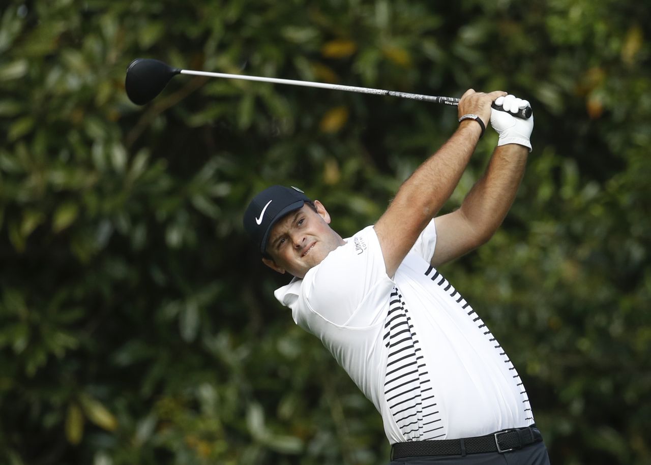 Patrick Reed hits a drive on the 11th hole during the second round of the Masters on Friday, April 6. Reed shot a 6-under 66 to take a two-stroke lead going into weekend play.