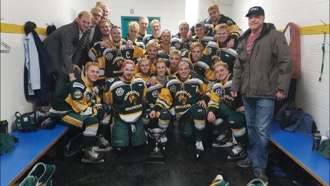 Members of the Humboldt Broncos pose for a photo after winning the Bourgault Cup in March. 