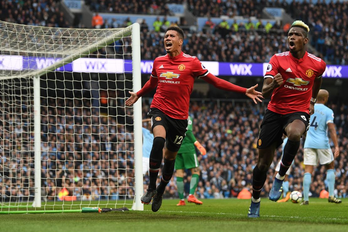 Chris Smalling celebrates scoring Manchester United's third goal with Paul Pogba.
