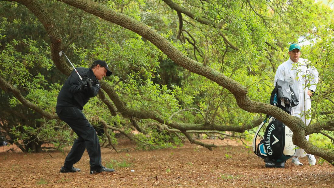 Phil Mickelson misses contact with the ball on the first hole during the third round of the 2018 Masters Tournament at Augusta National Golf Club on Saturday.