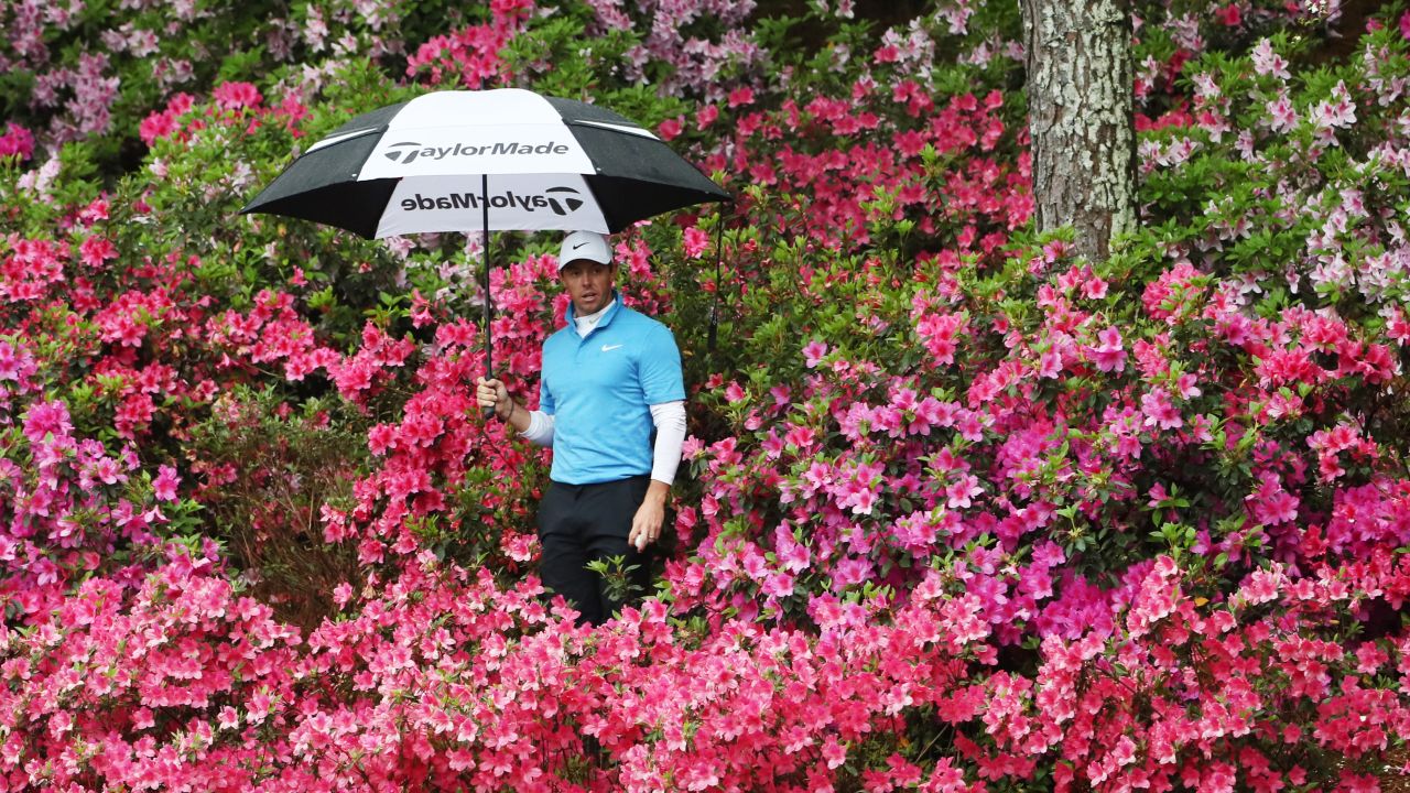 Rory McIlroy looks for his ball in the azalea bushes at the 13th hole during the third round of the 2018 Masters Tournament at Augusta National Golf Club on Saturday.