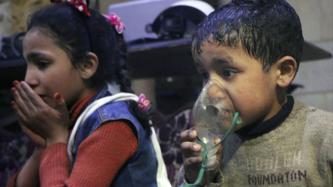 This image released early Sunday, April 8, 2018 by the Syrian Civil Defense White Helmets, shows a child receiving oxygen through respirators following an alleged poison gas attack in the rebel-held town of Douma, Syria.