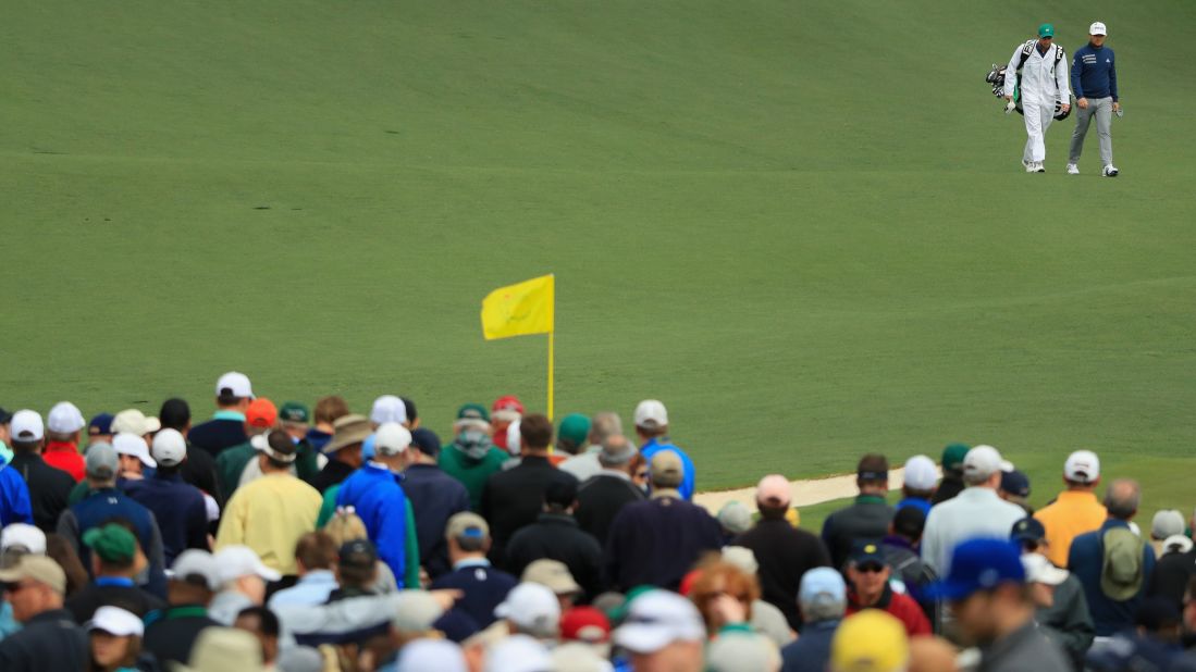 Tyrrell Hatton and Jonathan Bell walk on the second hole during the final round on Sunday. 