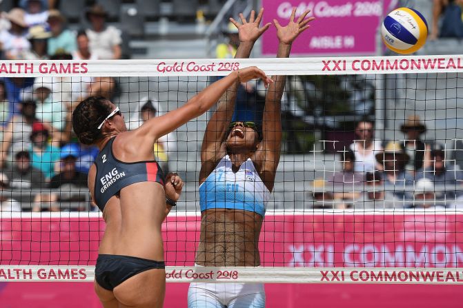 Laite Nima of Fiji tries to block Jessica Grimson of England. 