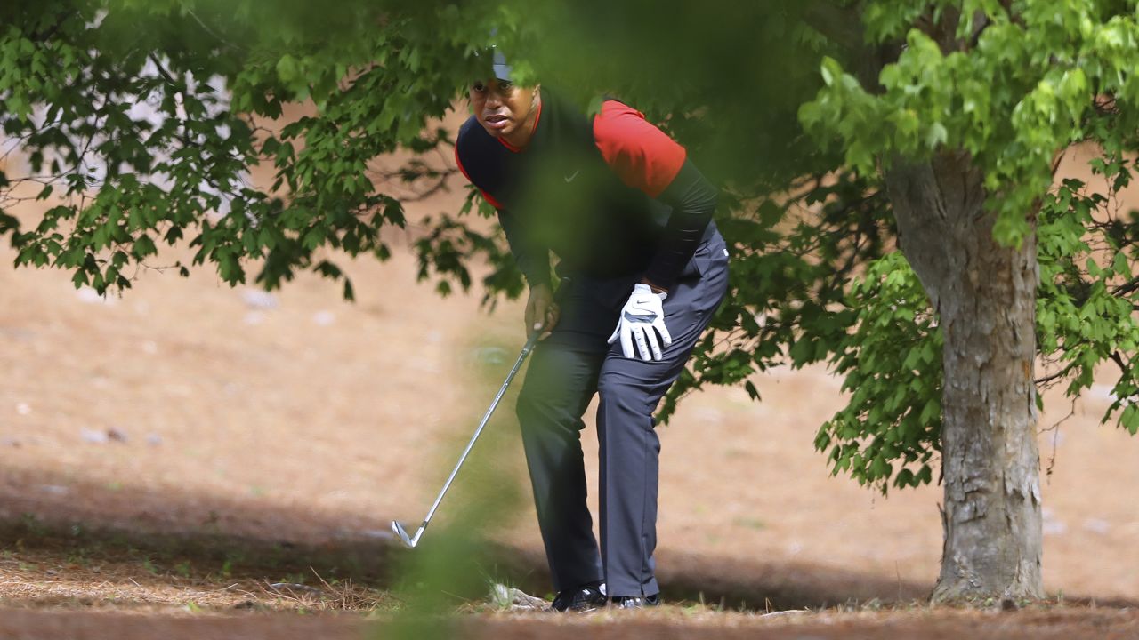 Tiger Woods prepares to hit out of the woods off the second fairway during his final round in the Masters on Sunday. 