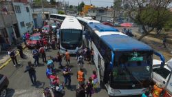 Central American migrants taking part in the "Migrant Via Crucis" caravan towards the United States, arrive in Puebla, Puebla State, Mexico, on April 6, 2018 where they will attend a legal clinic with NGOs on human rights.