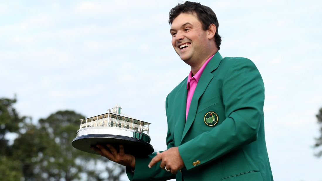 Patrick Reed celebrates with the trophy during the green jacket ceremony after winning the 2018 Masters Tournament on Sunday, April 8, in Augusta, Georgia.  