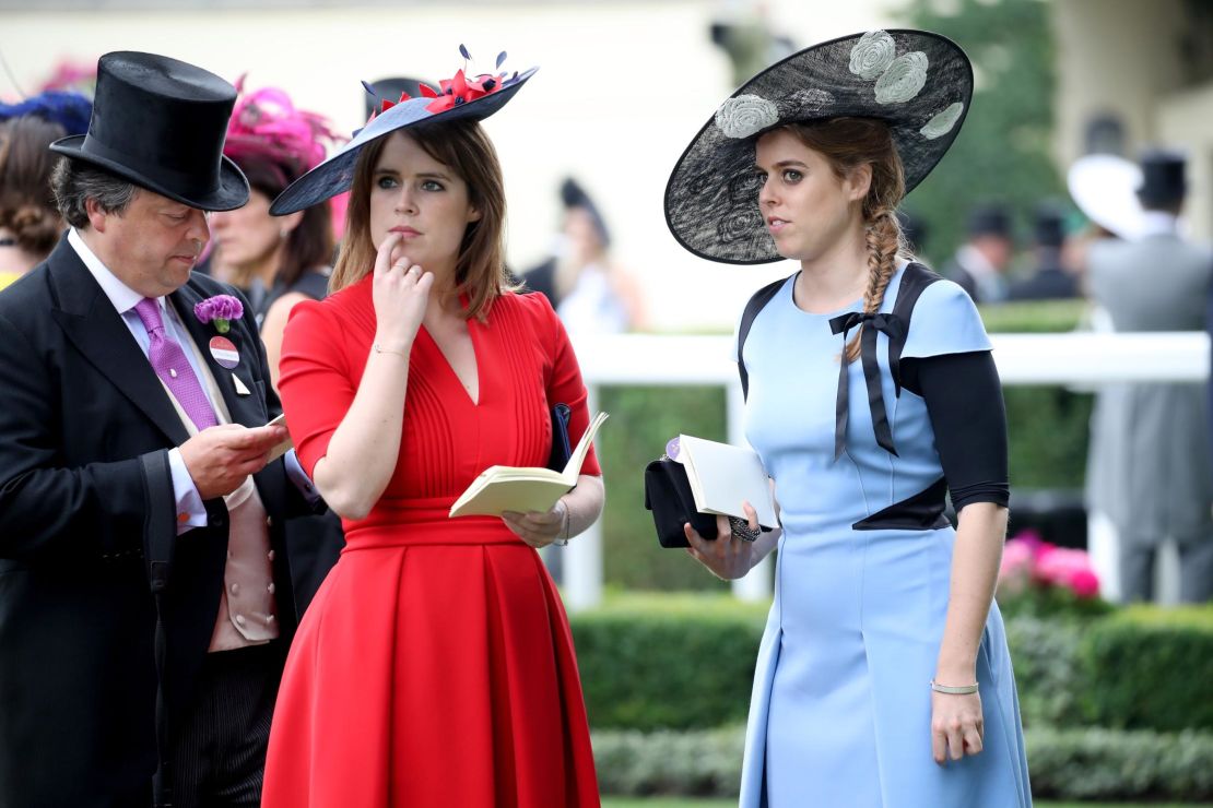 Princess Eugenie of York (center) and Princess Beatrice of York (right) at Royal Ascot in 2017. Both have HRH titles.