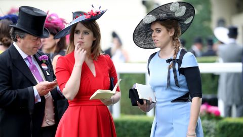 Princess Eugenie of York (center) and Princess Beatrice of York (right) at Royal Ascot in 2017. Both have HRH titles.