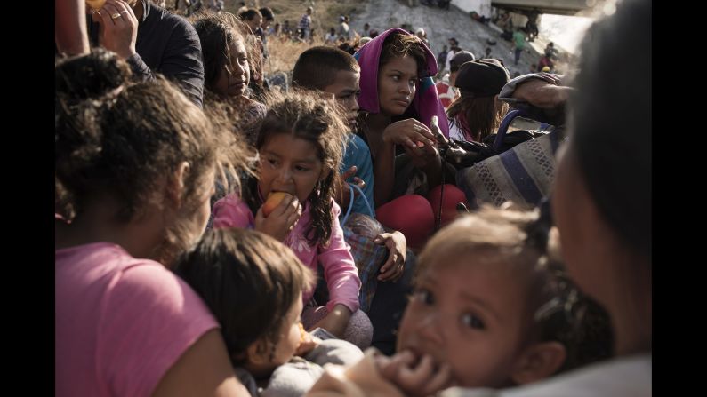 Migrants rest along a road in the Mexican town of Santiago Niltepec on Sunday, April 1.