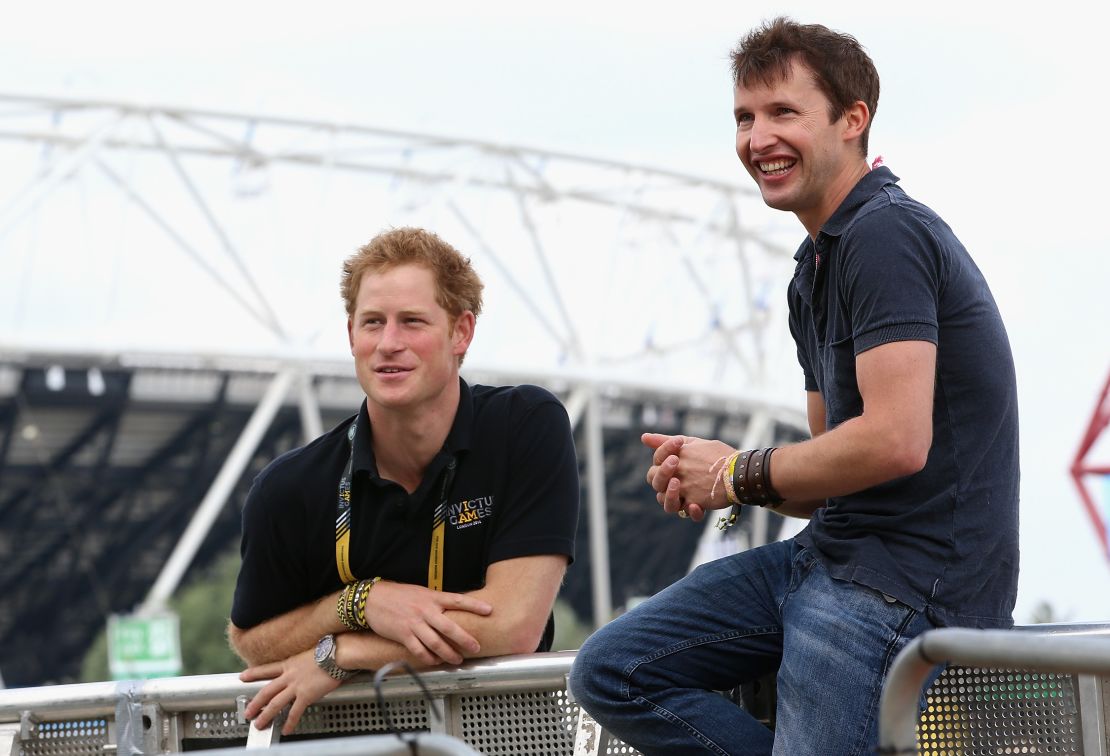 Prince Harry chats with singer James Blunt as he rehearses for the Invictus Games closing ceremony in London in 2014.