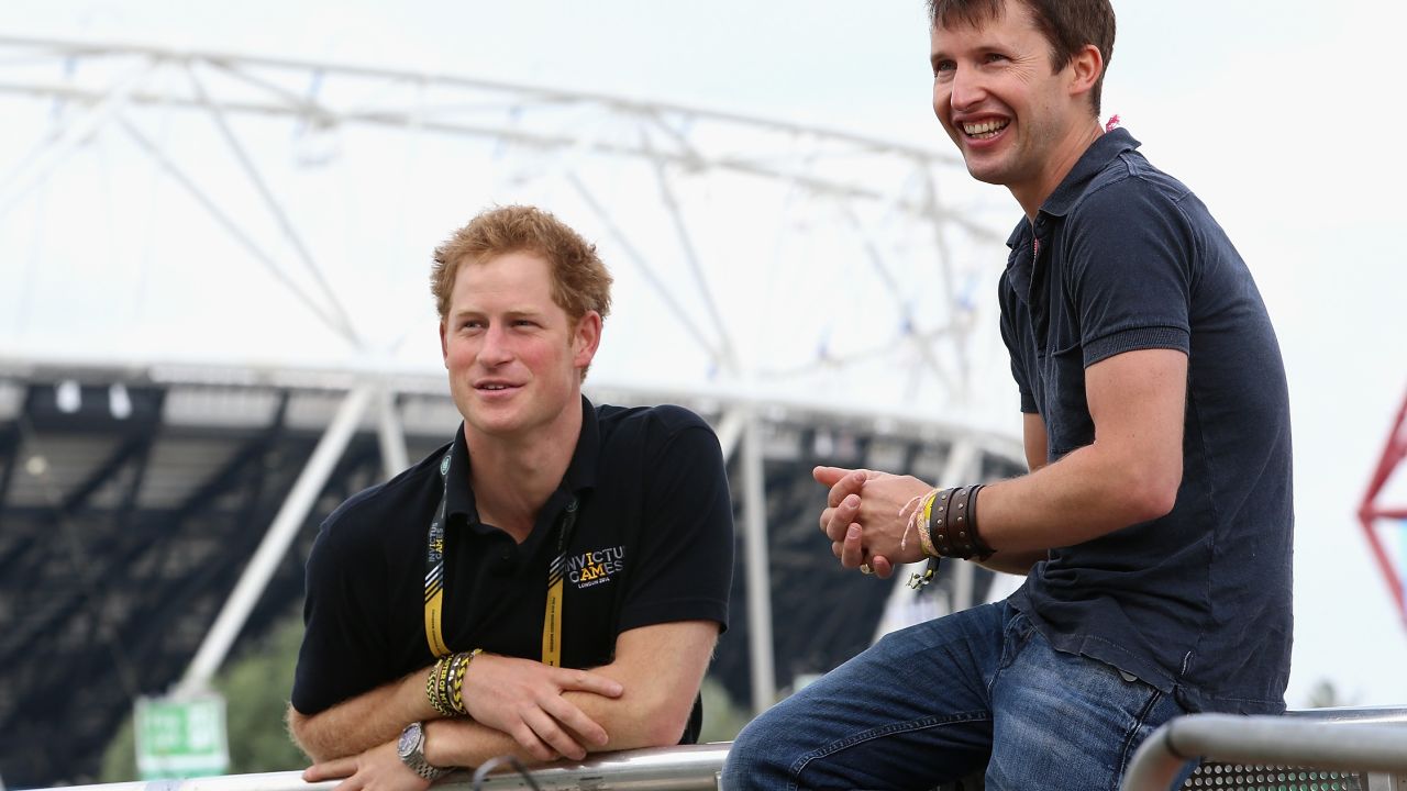 Prince Harry chats with singer James Blunt as he rehearses for the Invictus Games closing ceremony in London in 2014.