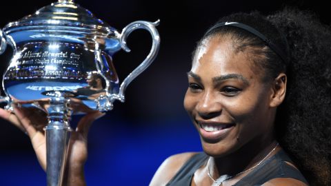 Serena Williams poses following her victory last year in the women's singles final in the Australian Open tennis tournament in Melbourne. 
