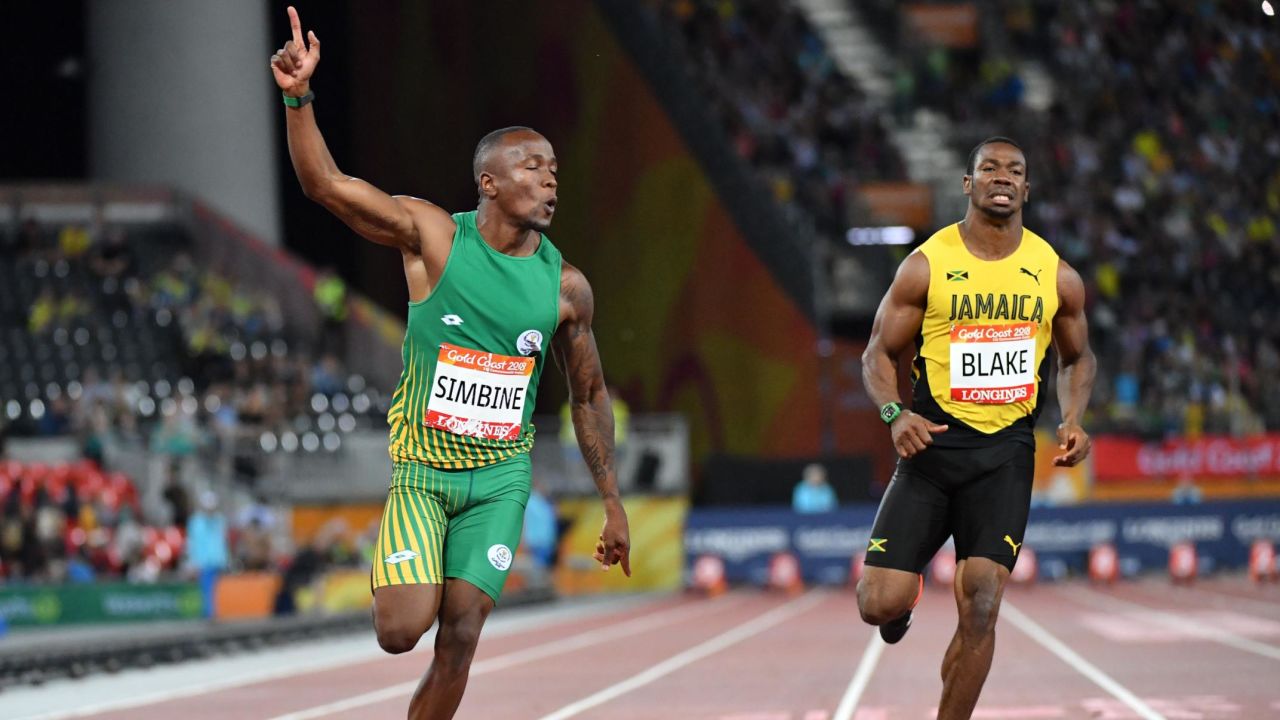 South Africa's Akani Simbine crosses the finish line to claim victory in the men's 100m final at the Commonwealth Games.