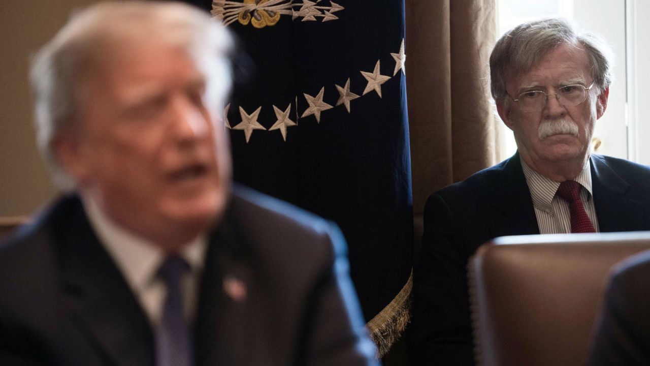New National Security Adviser John Bolton(R) listens to US President Donald Trump speak during a cabinet meeting at the White House in Washington, DC, on April 9, 2018.
President Donald Trump said Monday that "major decisions" would be made on a Syria response in the next day or two, after warning that Damascus would have a "big price to pay" over an alleged chemical attack on a rebel-held town.Trump condemned what he called a "heinous attack on innocent" Syrians in Douma, as he opened a cabinet meeting at the White House.
/ AFP PHOTO / NICHOLAS KAMM (Photo credit should read NICHOLAS KAMM/AFP/Getty Images)