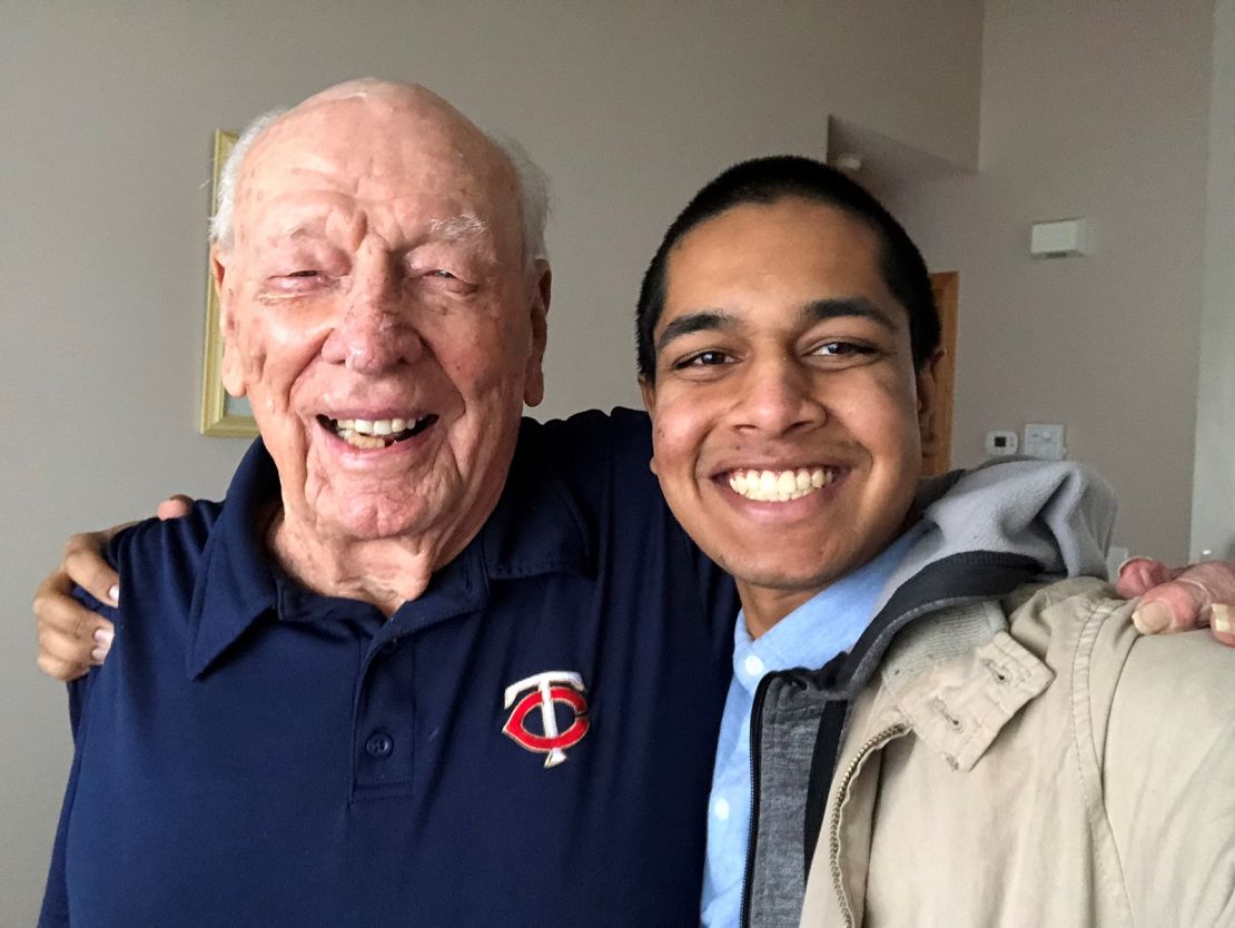 Rishi Sharma with Robert "Doc" Hanley, 95. After Hanley  was captured by the Japanese he was forced to work on the Burma railroad as a slave laborer. 
