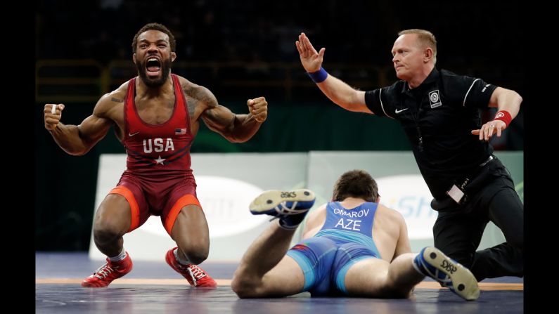 American wrestler Jordan Burroughs celebrates after pinning Azerbaijan's Gasjimurad Omarov at the Freestyle Wrestling World Cup on Sunday, April 8. The American team won the tournament, which was held in Iowa City, Iowa.