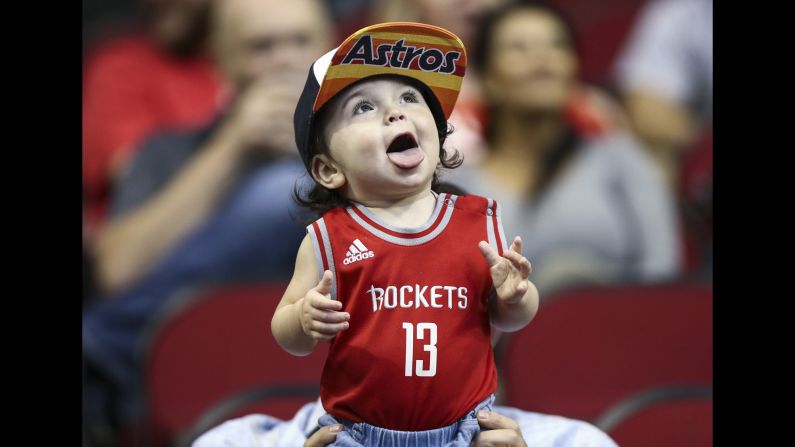 A child watches warmups before an NBA game in Houston on Thursday, April 5.