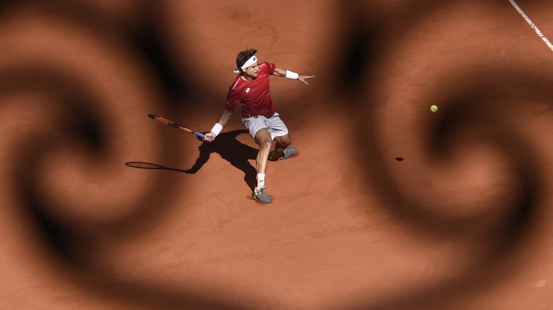 Spain's David Ferrer returns a shot during the Davis Cup quarterfinals on Sunday, April 8. The team event was held at a historic bullring in Valencia, Spain. The home team advanced to the semifinals after Ferrer defeated Germany's Philipp Kohlschreiber in five sets.