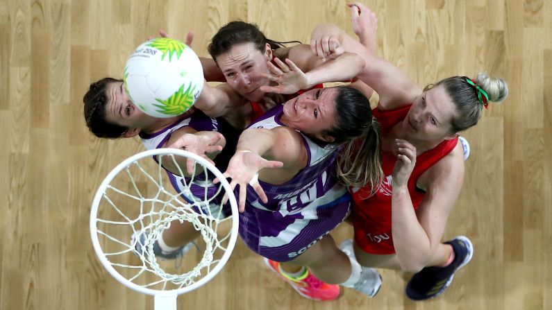 Netball players from Wales and Scotland compete for the ball during a match at the Commonwealth Games on Saturday, April 7.