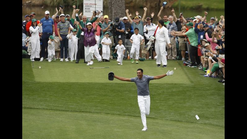 Tony Finau celebrates after hitting a hole-in-one during the Masters' par-3 contest on Wednesday, April 4. <a target="_blank">He dislocated his ankle during the celebration,</a> popped it back in himself, and went on to play in the tournament the next day.