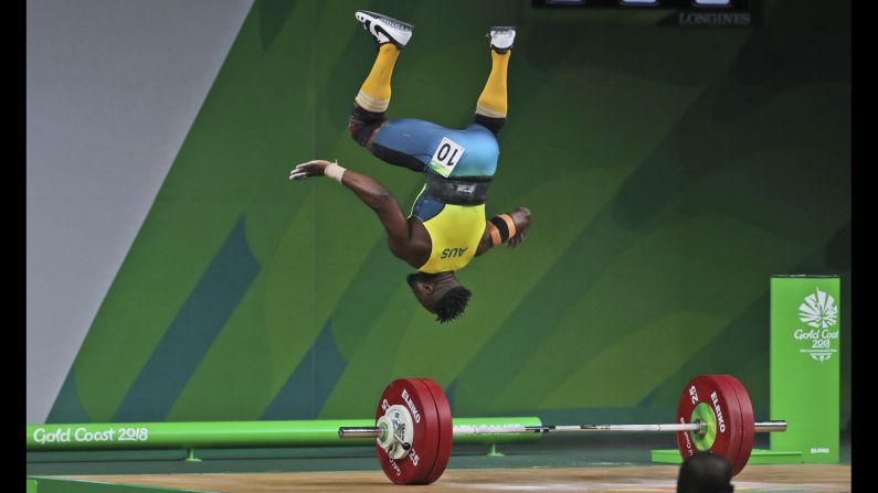 Australian weightlifter Francois Etoundi does a celebratory flip after completing a lift at the Commonwealth Games on Saturday, April 7. He finished with the bronze in his weight class.
