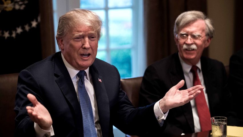 US President Donald Trump speaks during a meeting with senior military leaders at the White House in Washington, DC, on April 9, 2018. At right is new National Security Advisor John Bolton.President Donald Trump said Monday that "major decisions" would be made on a Syria response in the next day or two, after warning that Damascus would have a "big price to pay" over an alleged chemical attack on a rebel-held town.Trump condemned what he called a "heinous attack on innocent" Syrians in Douma, as he opened a cabinet meeting at the White House.  / AFP PHOTO / NICHOLAS KAMM        (Photo credit should read NICHOLAS KAMM/AFP/Getty Images)