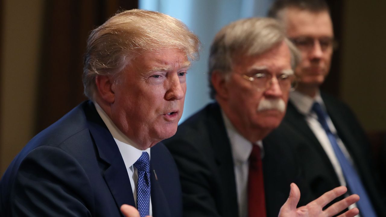 WASHINGTON, DC - APRIL 09:  U.S. President Donald Trump is flanked by National Security Advisor John Bolton as he speaks about the FBI raid at his lawyer Michael Cohen's office, while receiving a briefing from senior military leaders regarding Syria,  in the Cabinet Room, on April 9, 2018 in Washington, DC. The FBI raided the office of Michael Cohen on Monday as part of the ongoing investigation into the president's administration. (Photo by Mark Wilson/Getty Images)