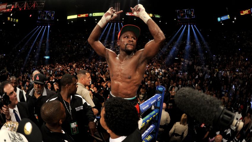 LAS VEGAS, NV - MAY 03:  Floyd Mayweather Jr. celebrates after defeating Marcos Maidana by majority decision in their WBC/WBA welterweight unification fight at the MGM Grand Garden Arena on May 3, 2014 in Las Vegas, Nevada.  (Photo by Harry How/Getty Images)