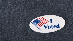 Royalty-free stock photo ID: 415632082

Closeup of an American "I voted" sticker placed on a navy shirt.