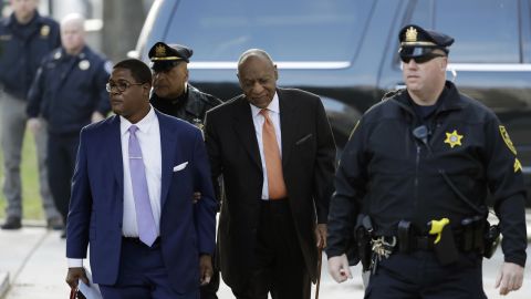 Bill Cosby, center, arrives at the courthouse on April 10.