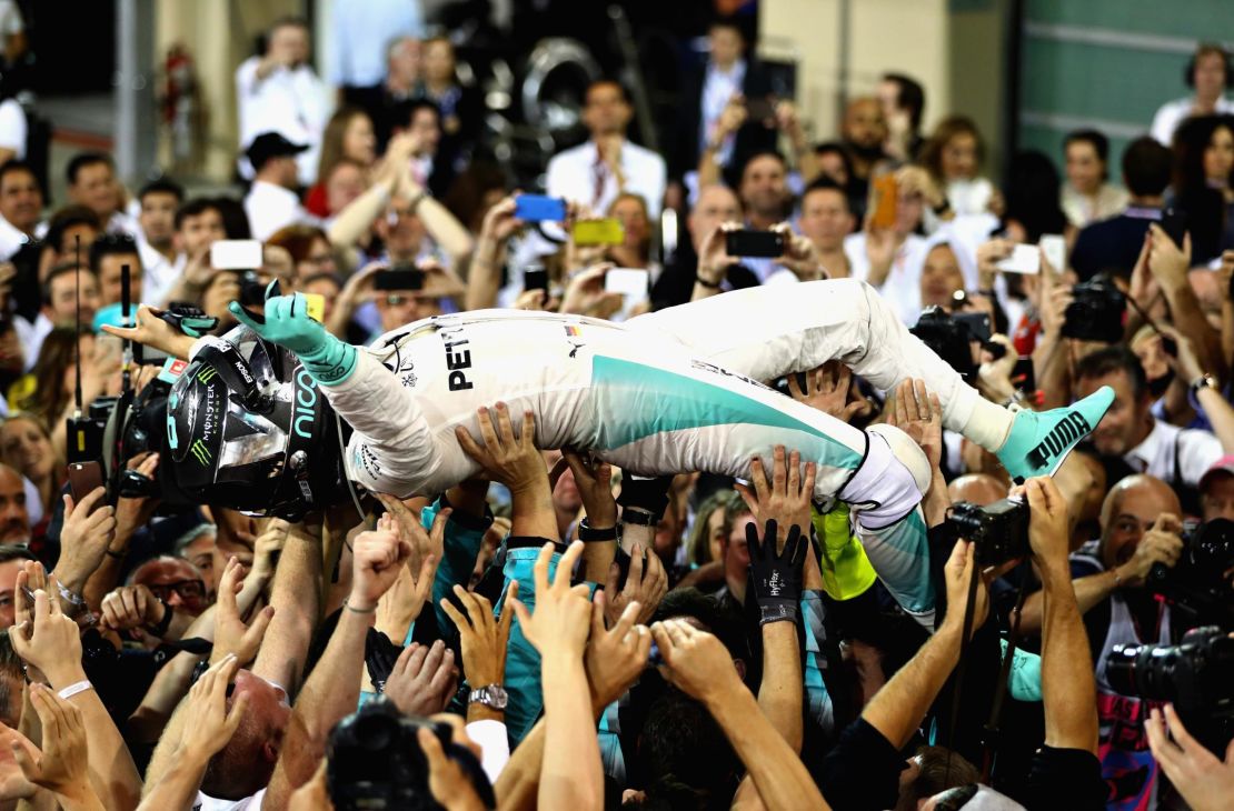 Nico Rosberg celebrates after finishing second and winning the World Drivers Championship during the Abu Dhabi Formula One Grand Prix at Yas Marina Circuit on November 27, 2016.