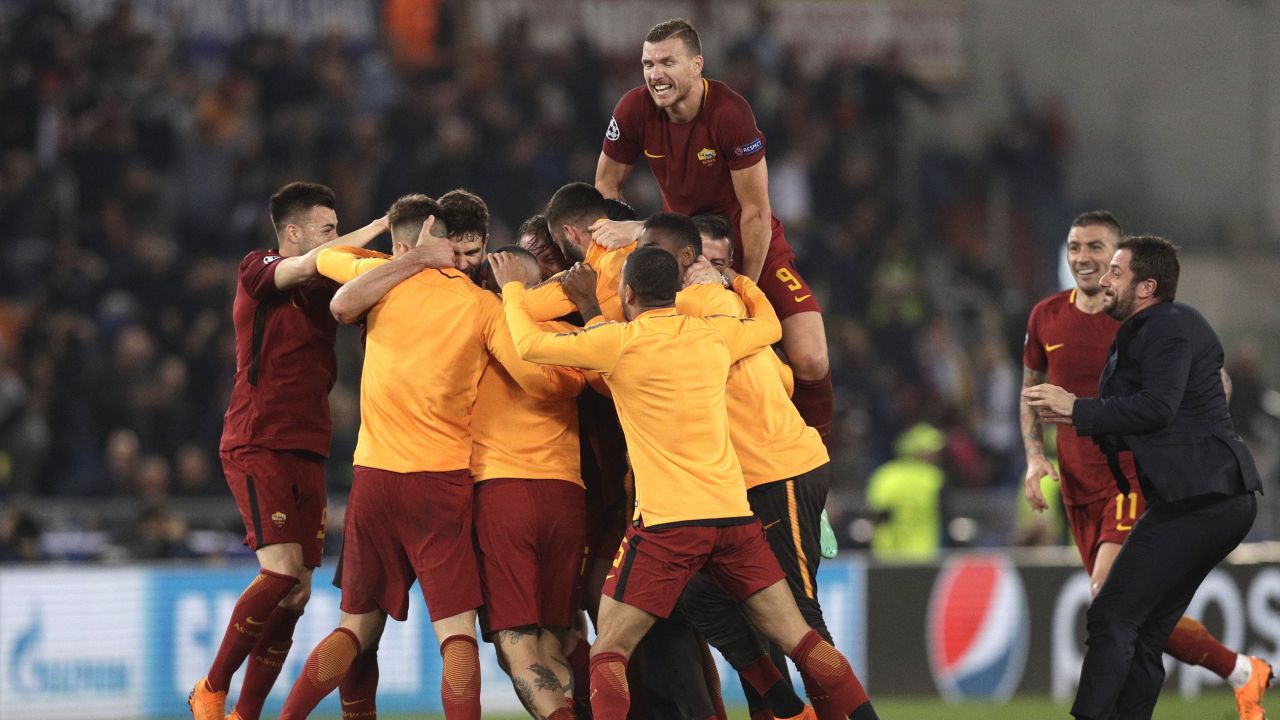 AS Roma players celebrate at the end of the Champions League quarterfinal second leg soccer match between Roma and FC Barcelona at Rome's Olympic Stadium on Tuesday.