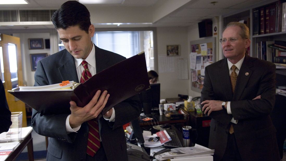 Ryan and US Rep. Jim McCrery review materials in 2005 before a news conference.